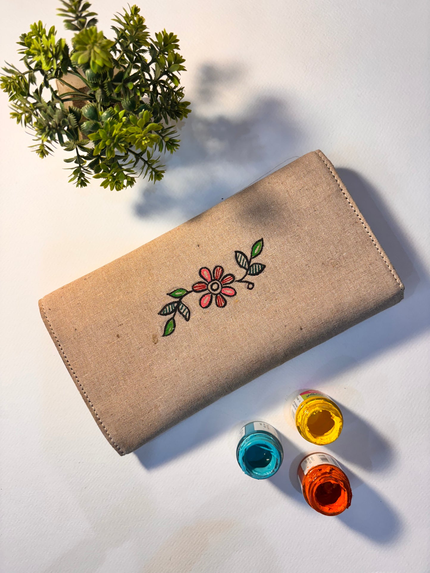 Peacock motif jute clutch