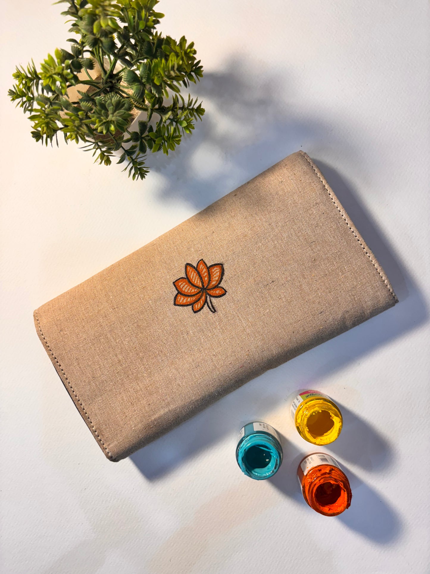 Lotus motif handpainted jute clutch
